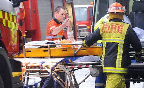 After a one hour rescue the victim of the single vehicle accident on the Bruxner Highway near Richmond Hill Road yesterday (Wednesday) morning clasps the hand of one of the many involved in the rescue. After a one hour rescue the victim of the single vehicle accident on the Bruxner Highway near Richmond Hill Road yesterday (Wednesday) morning clasps the hand of one of the many involved in the rescue.